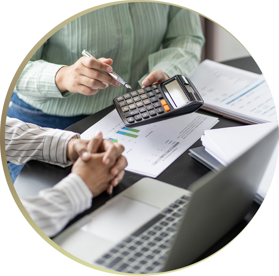 People discussing financial documents, using calculator.